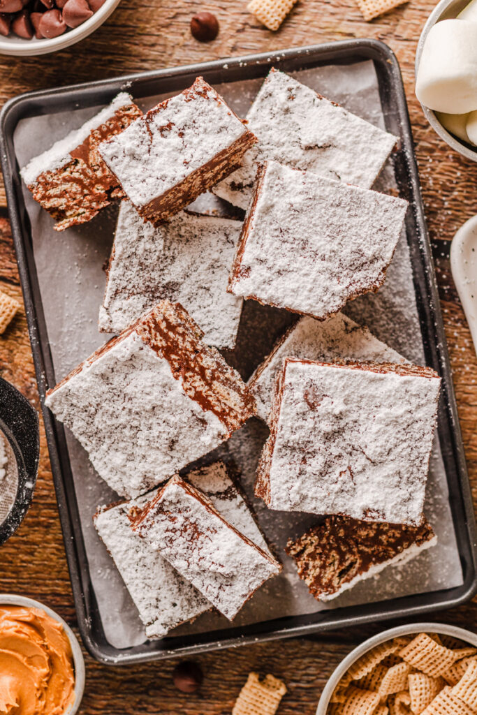 a crunchy cereal bar coated with chocolate, peanut butter, and powdered sugar.