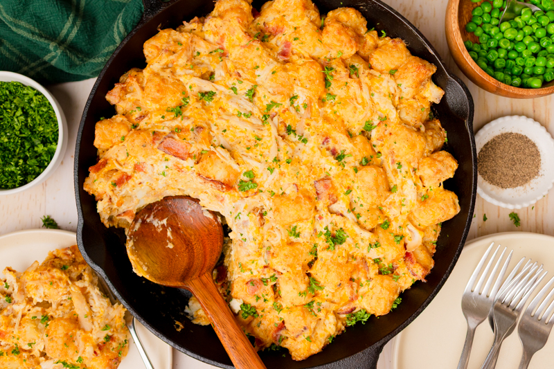 a cast iron skillet with Chicken Tater Tot Casserole.