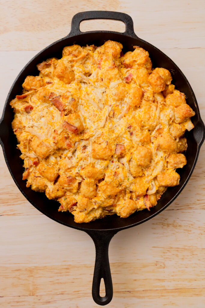 a baked Chicken Tater Tot Casserole in a skillet.