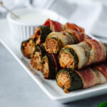 crispy Stuffed Jalapenos served with Ranch dressing on a white plate.