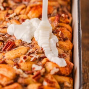 an up close look at the drizzle going on the french toast bake