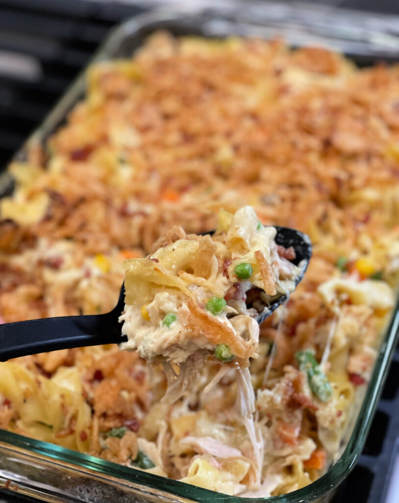 creamy one pan meal loaded with chicken, cheese, pasta, and bacon