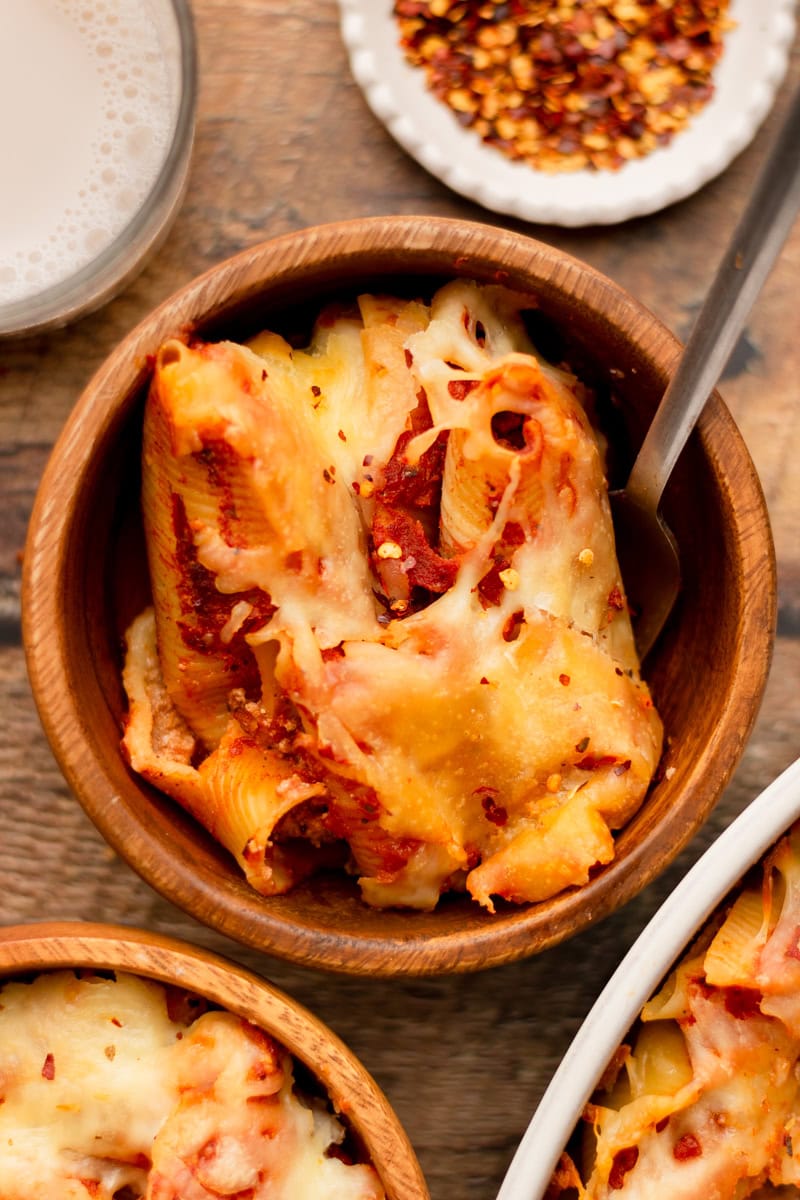 a wood bowl with a serving of lasagna stuffed shells.