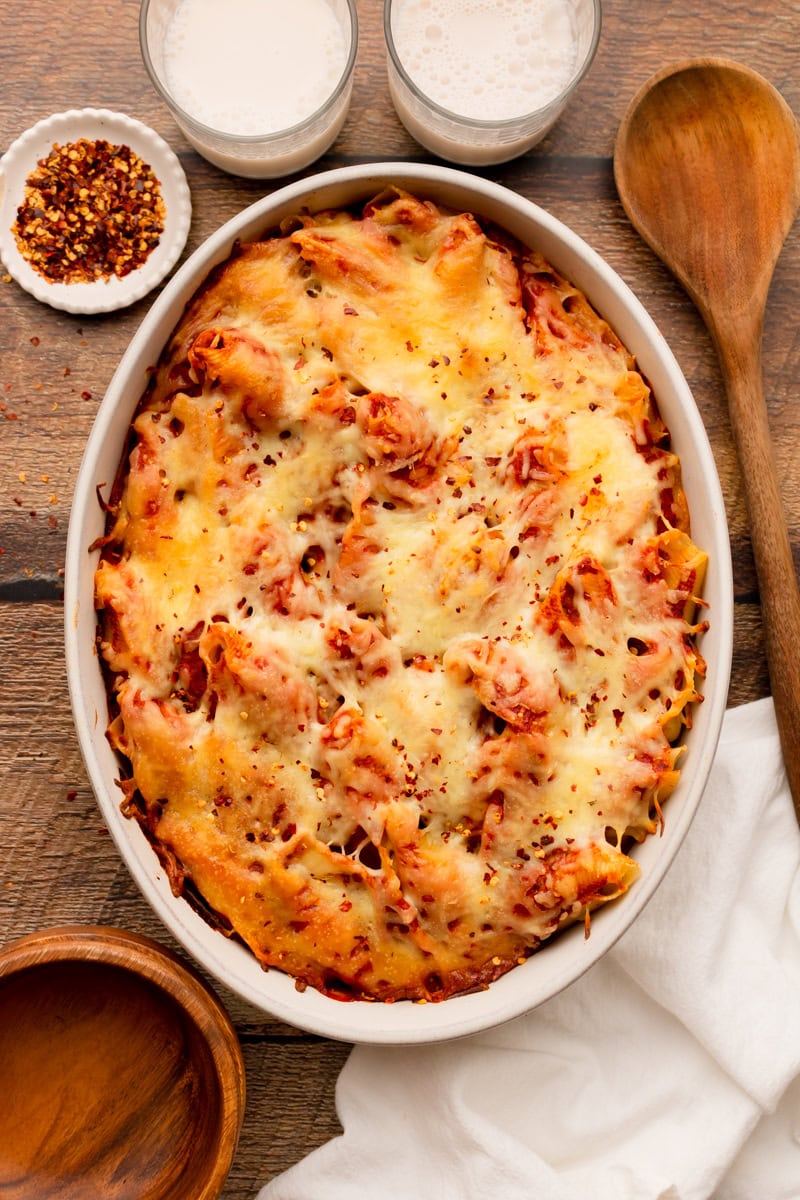 melted cheese on top of baked stuffed shells.