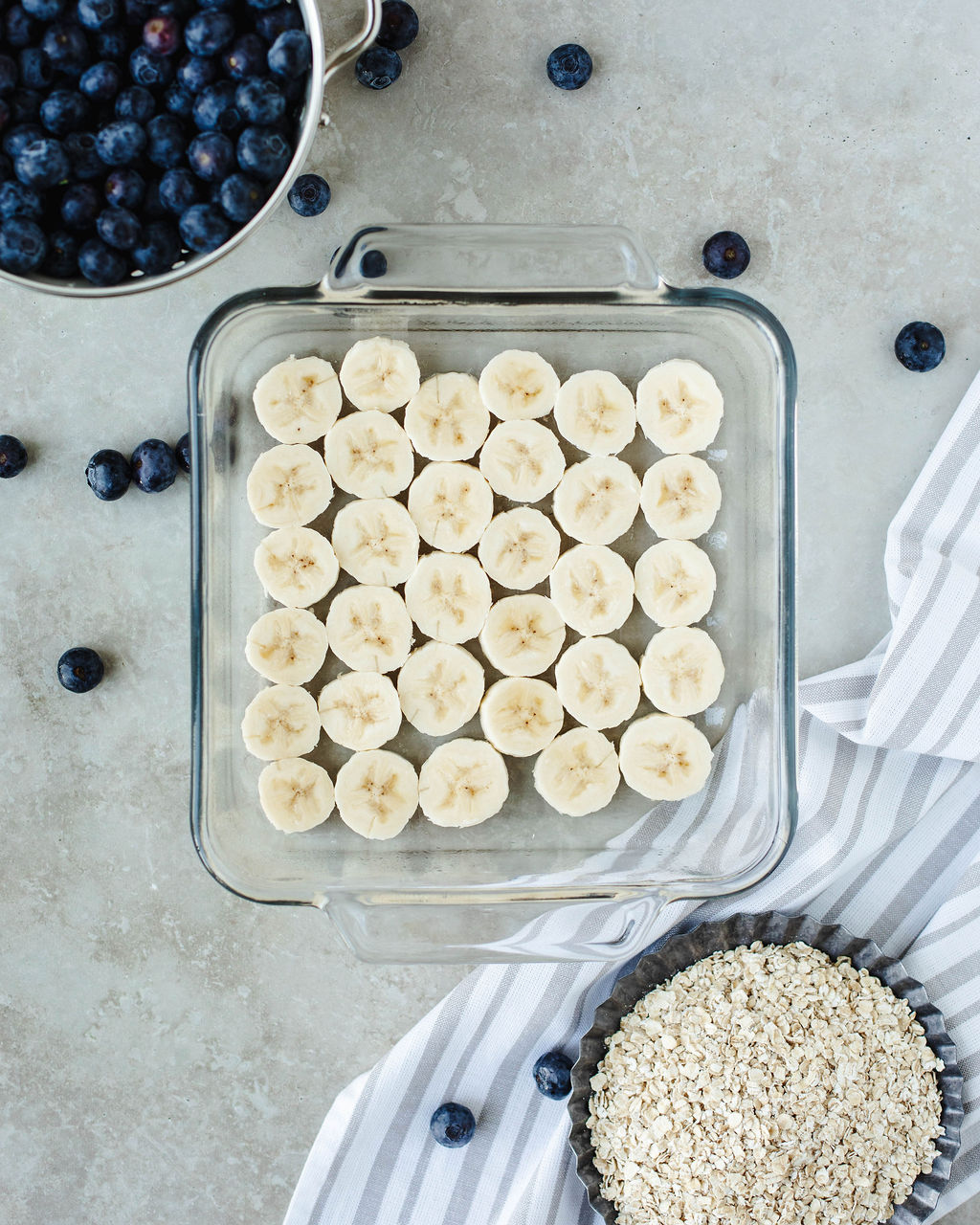 banana slices layering the bottom of a baking dish.