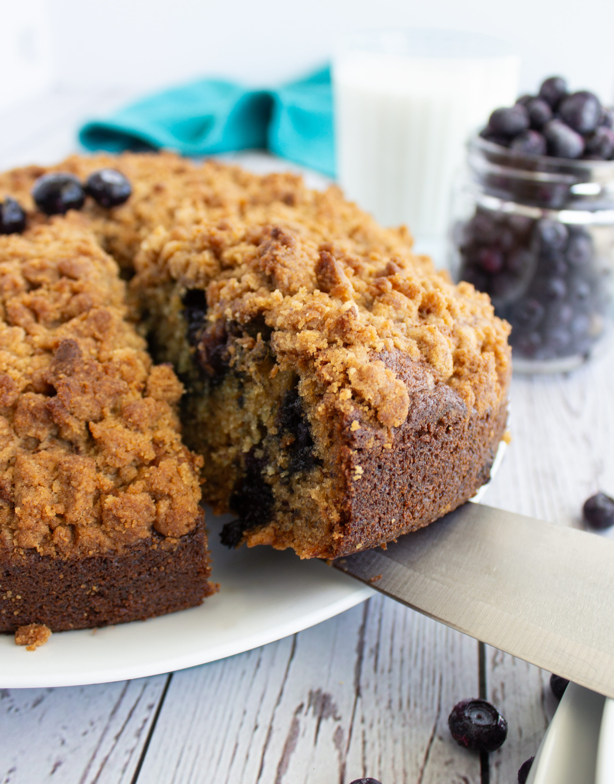 a streusel topped banana blueberry coffee cake ready to serve.