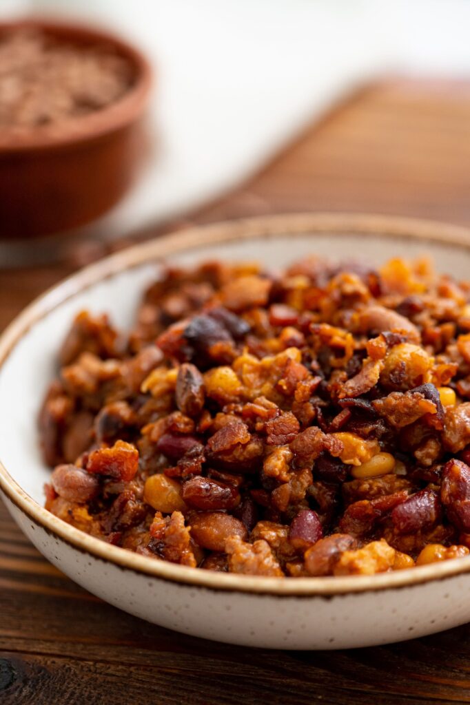 tender beans cooked with bacon, beef, beans, and more