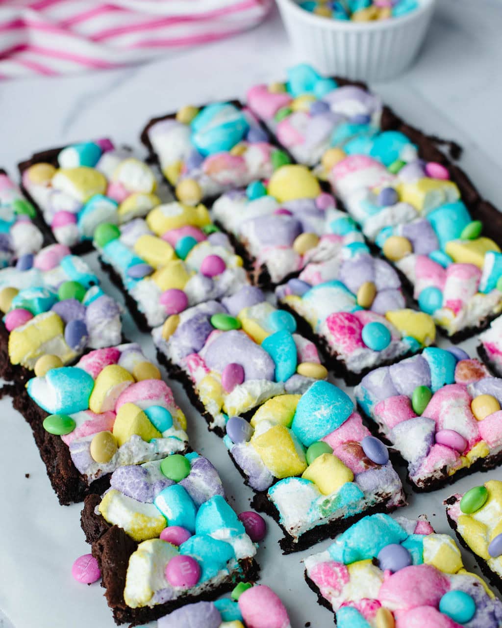 peep bars with a chocolate cake base and cut up peeps