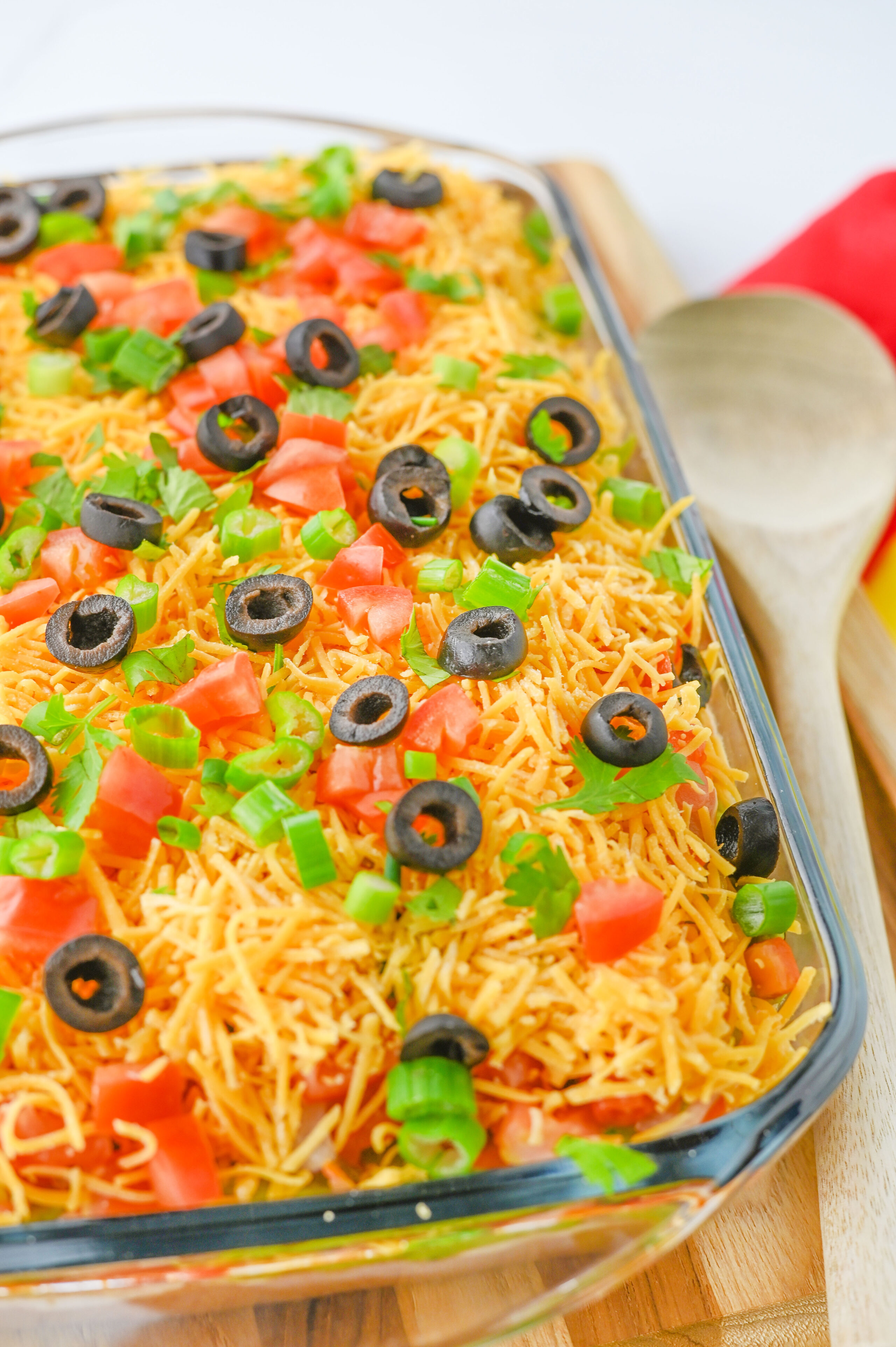 layered taco dip in a glass dish.