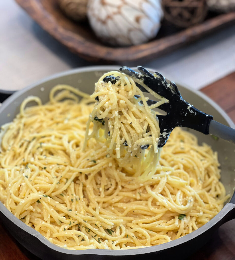 lemon juice, parmesan, and basil combined into a flavorful sauce over spaghetti noodles