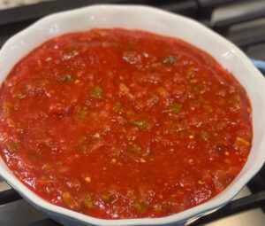 salsa covered over a cream cheese mixture