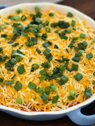 an easy layered nacho dip using only a few ingredients