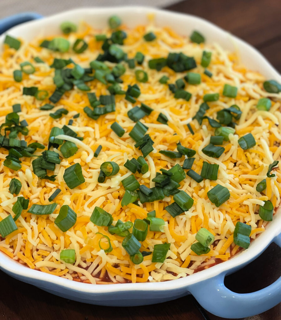 an easy layered nacho dip using only a few ingredients