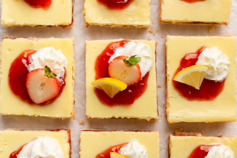 sliced dessert bars on a piece of parchment paper.