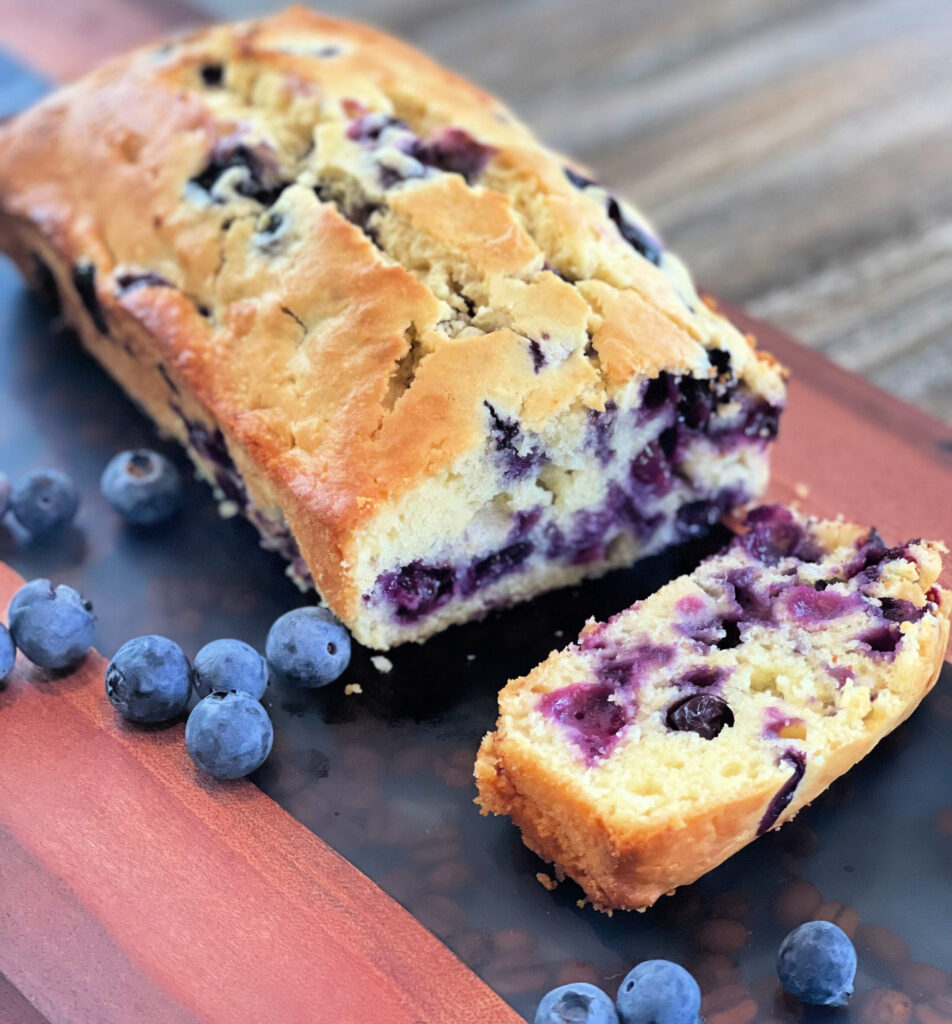 blueberry quick bread with cream cheese included in the batter to keep it oist