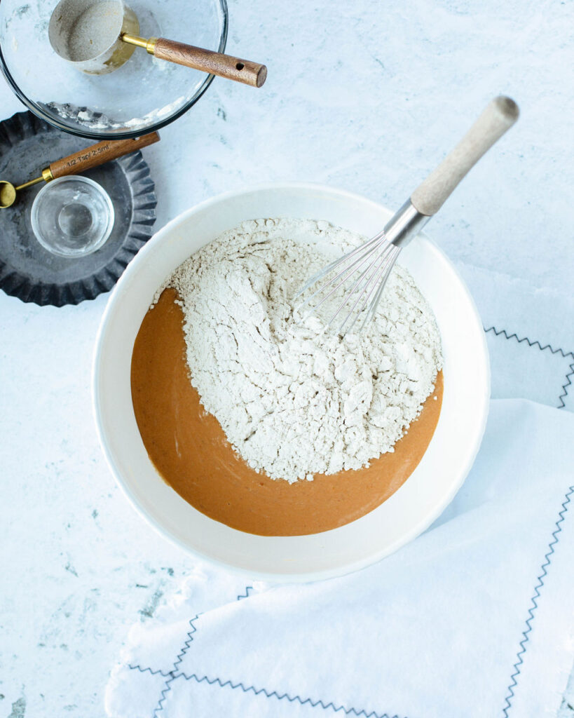 flour and wet ingredients in a mixing bowl.