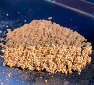 seasoned taco meat on a griddle