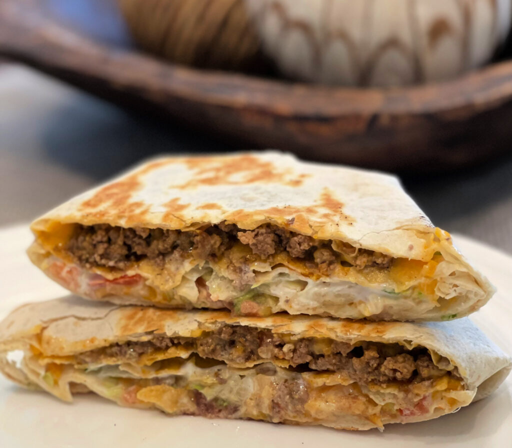 crunchwrap supreme stacked on a plate