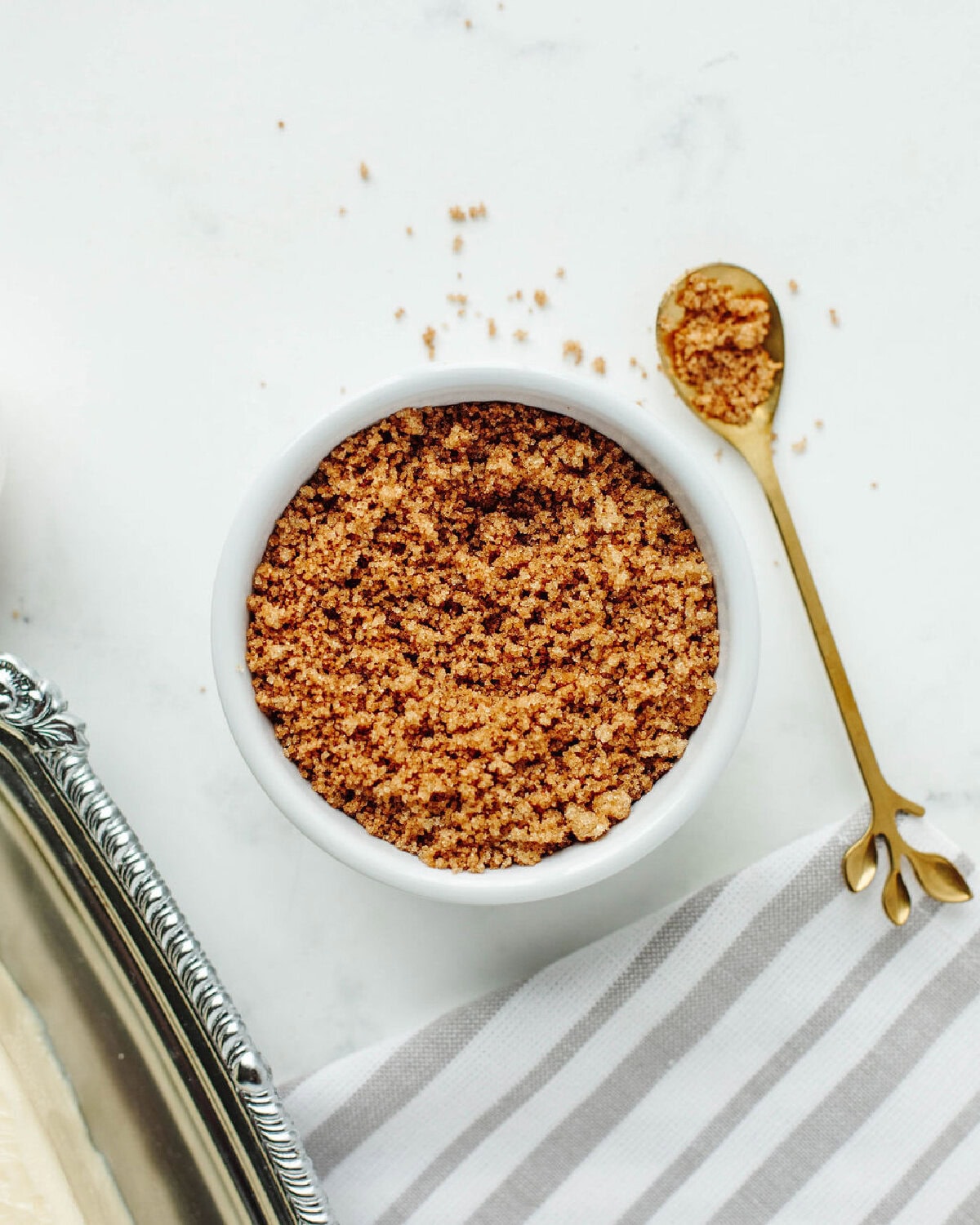 brown sugar and cinnamon combined in a small white bowl to add a streusel.