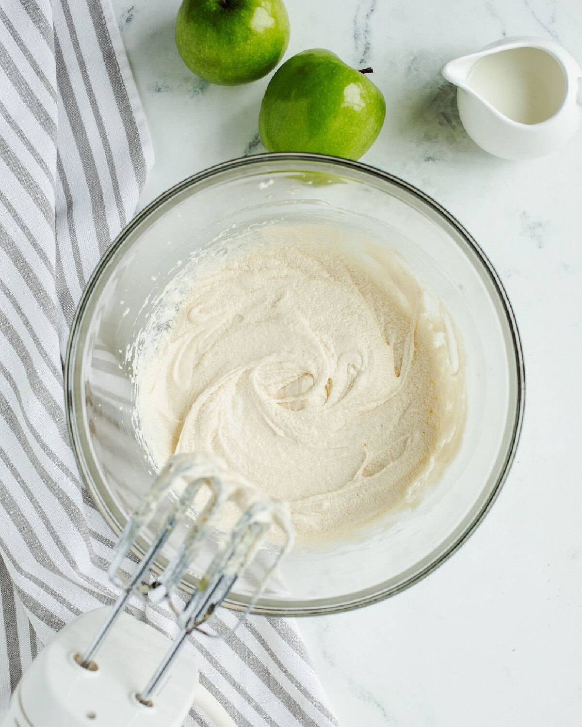 creamed butter and sugar in a glass mixing bowl.