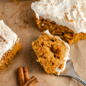 a bite taken out of a piece of fall cake with warm spices throughout