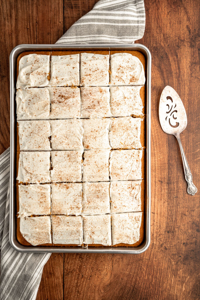 cream cheese frosted pumpkin bars in a pan