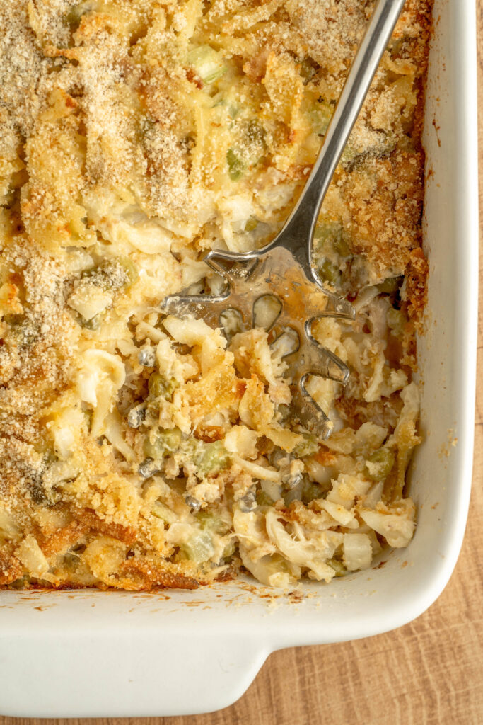 comfort food creamy tuna noodle casserole baked in a 9x13 baking pan.