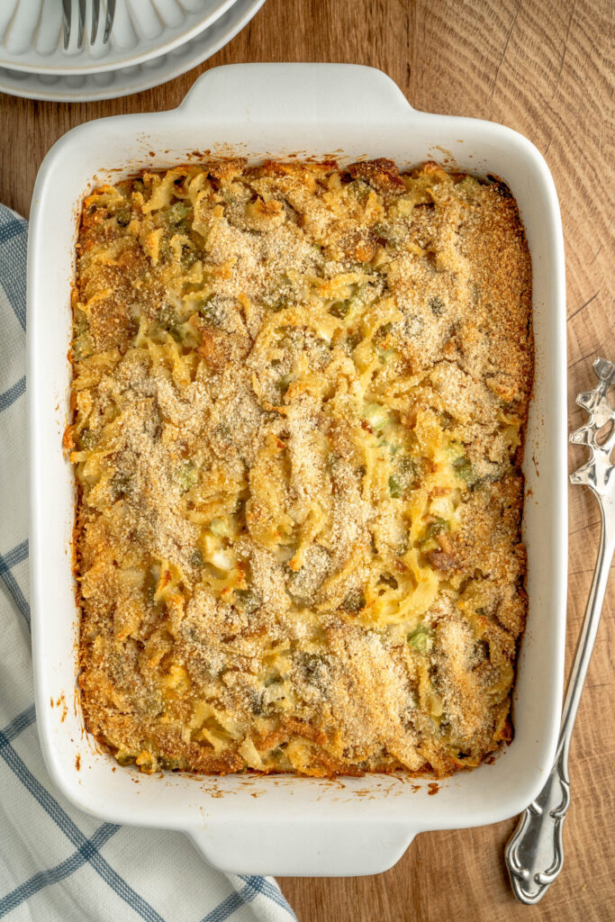 a top look down at a baked old fashioned noodle bake with tuna throughout.