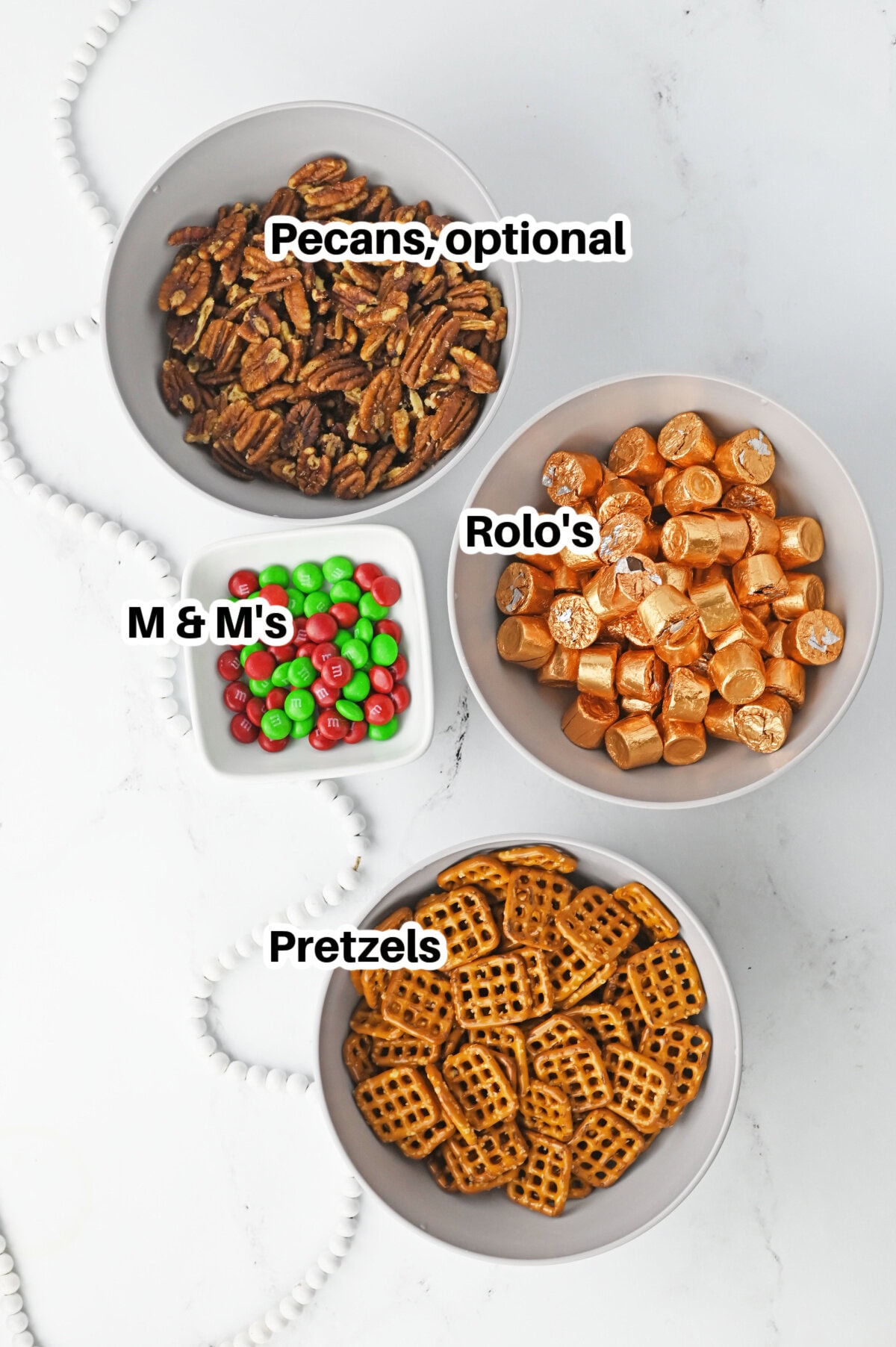 all the ingredients needed to make rolo pretzel treats.