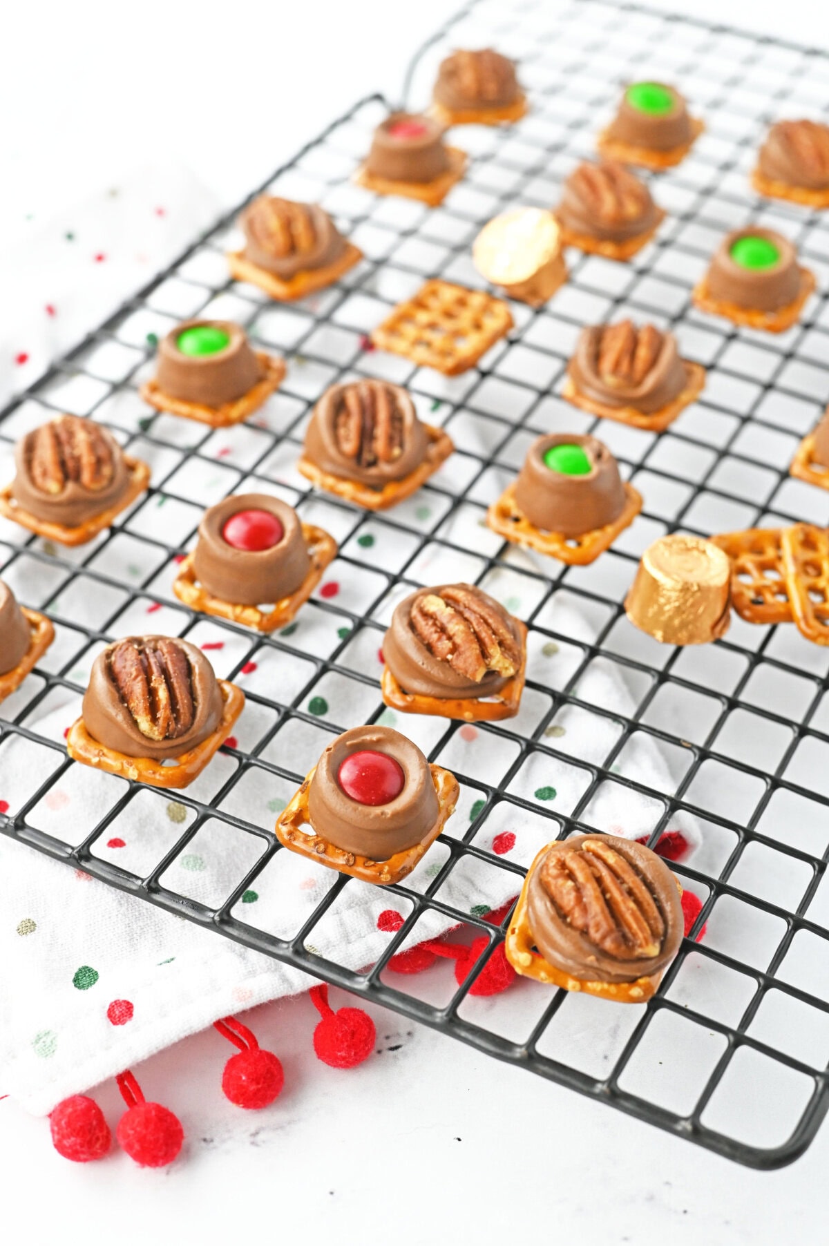 rolo pretzel treats cooling on a wire rack.