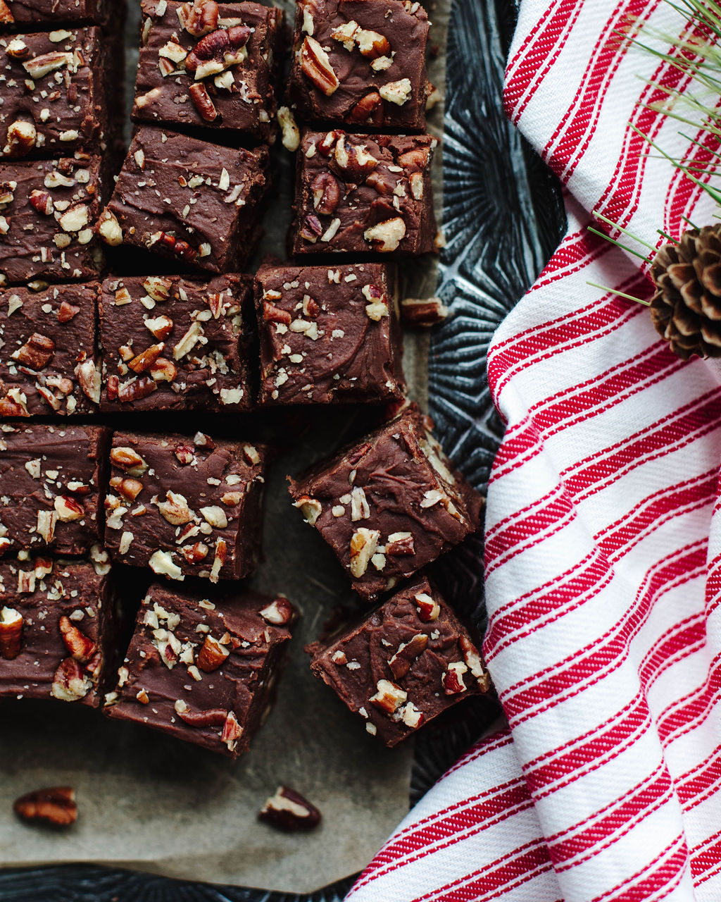 pieces of fantasy fudge cut and placed near a red and white linen.