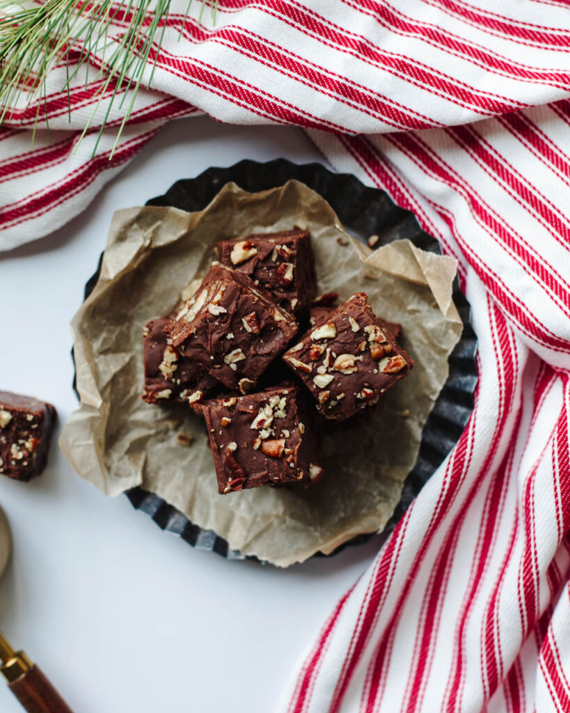 a red and white linen with pieces of chocolate fudge.