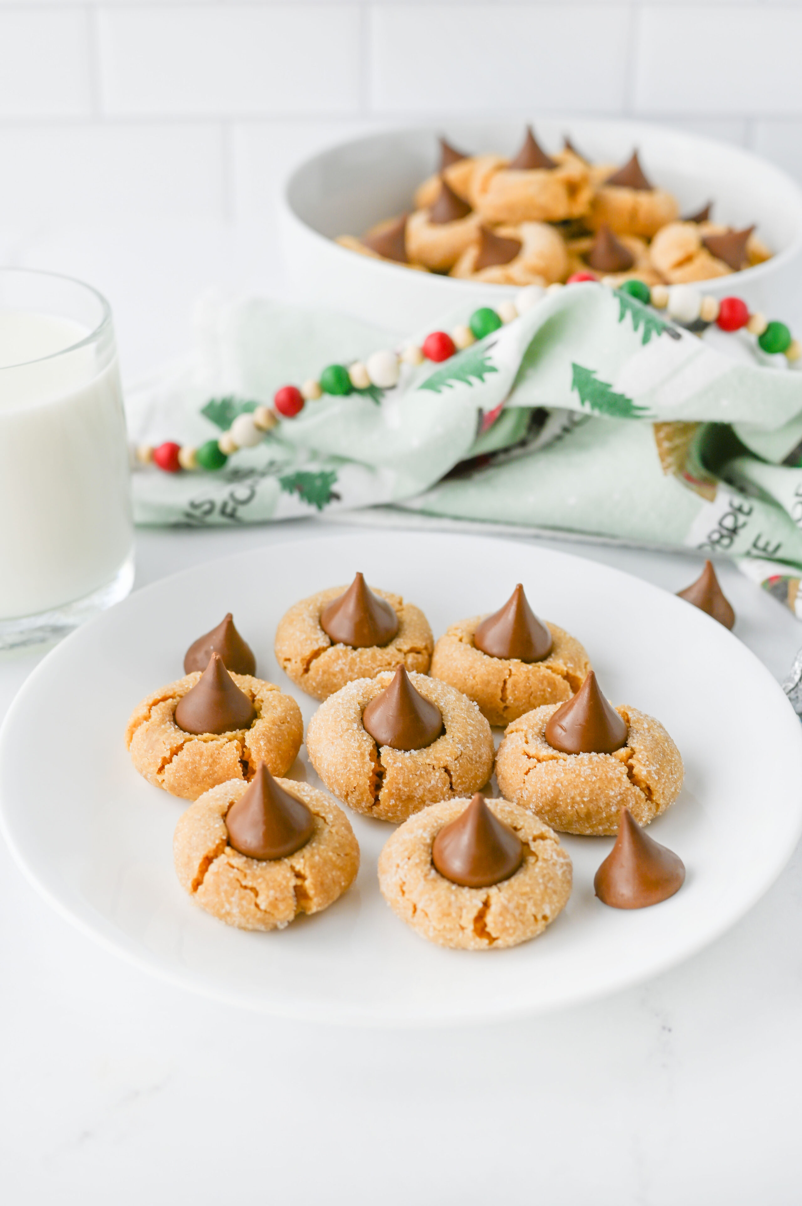 peanut butter blossoms on a white plate.