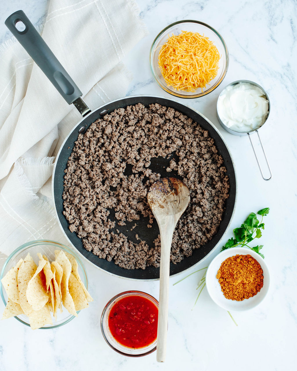 all the ingredients needed to make cheesy nacho bake.