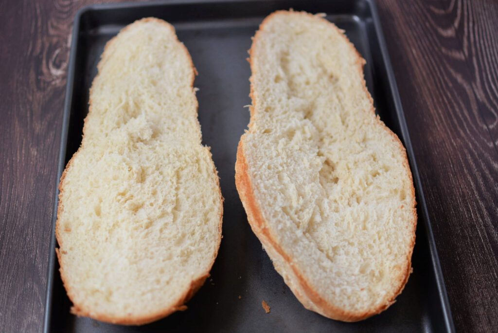 sliced french bread on a cookie sheet