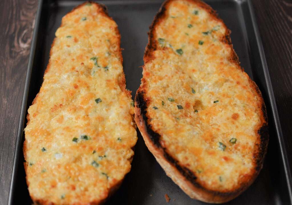 three cheese garlic bread baked and ready to serve