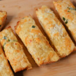 cheesy garlic bread sliced and ready to serve