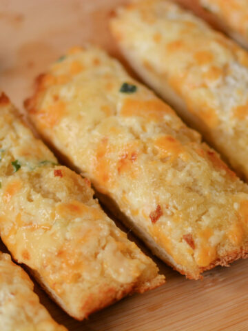 baked french bread with cheese and garlic on top