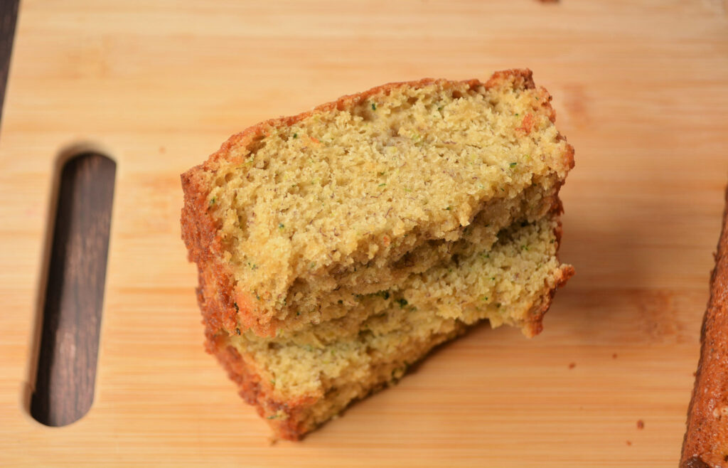 slices of zucchini banana bread on a cutting board