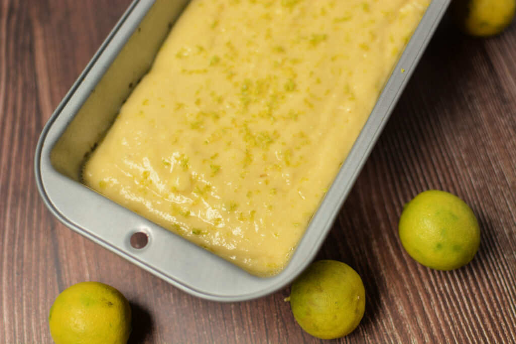 bread batter poured into a pan and ready to bake