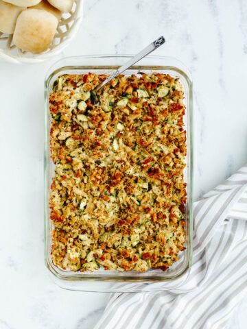 a baked one pan meal with fresh summer vegetables, shredded meat, and stuffing.