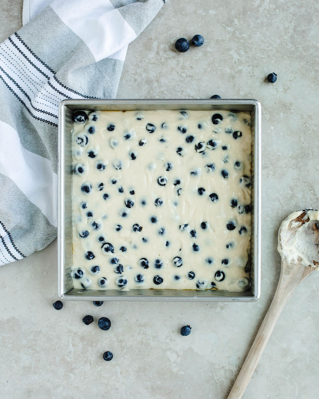 blueberry coffee cake batter ready to be topped with streusel.