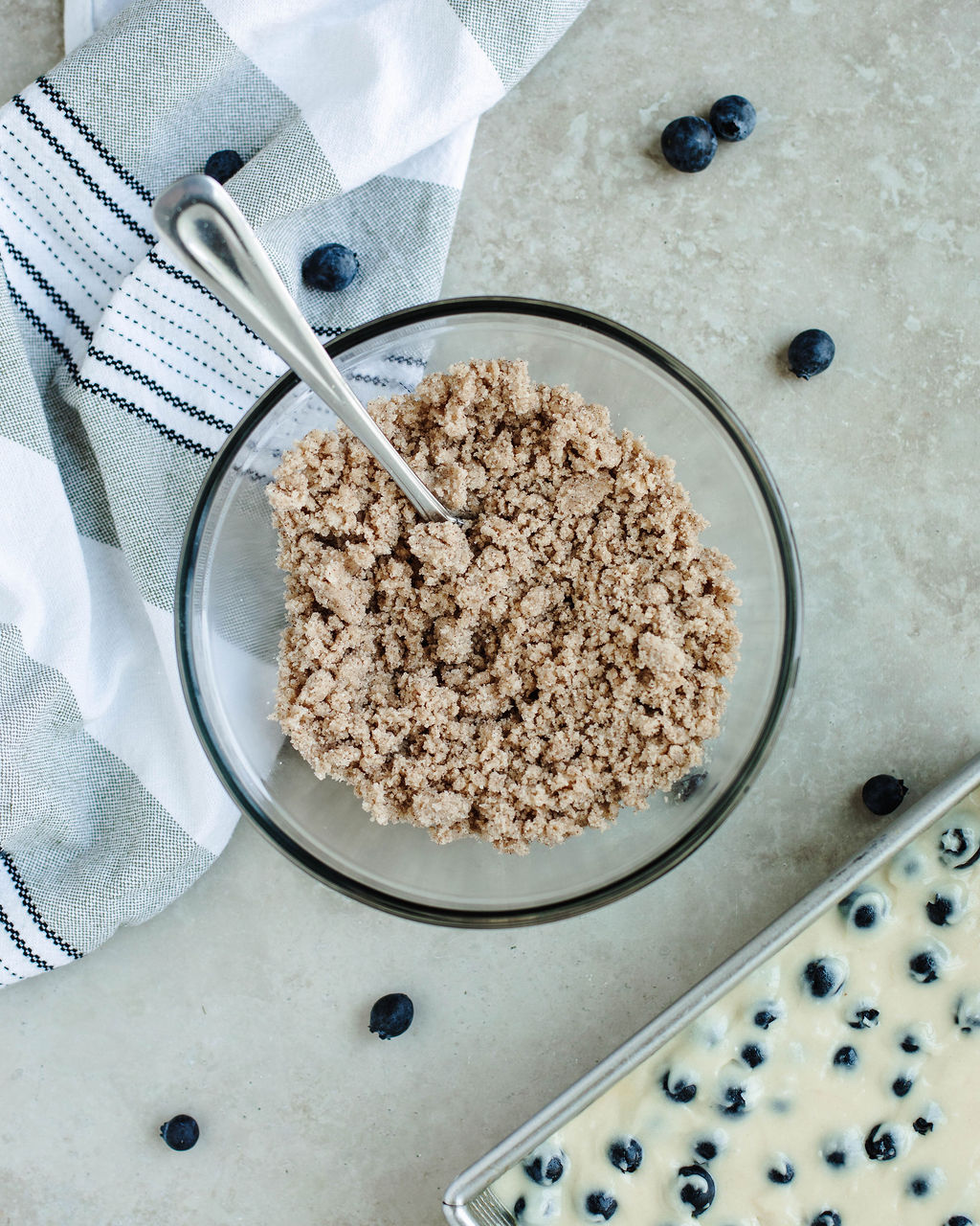 a crumb topping made in a glass bowl.