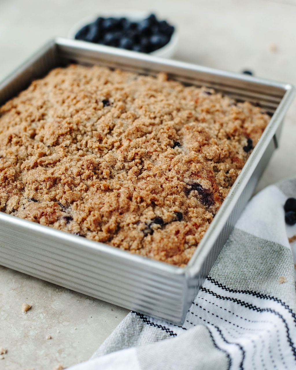 blueberry coffee cake in a 8x8 baking pan.