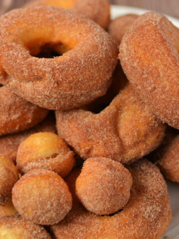 a stack of fried donuts on a plate