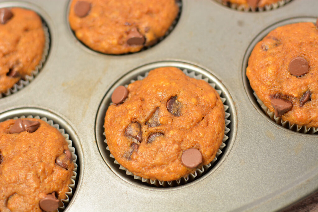 an up close look at pumpkin banana chocolate chip muffins