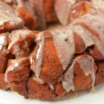 pumpkin monkey bread drizzled with icing on top.