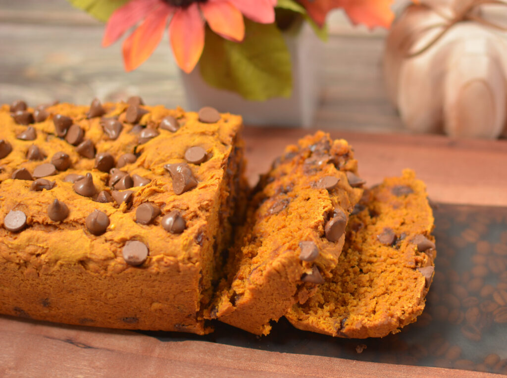 slices of pumpkin chocolate chip bread on a serving board