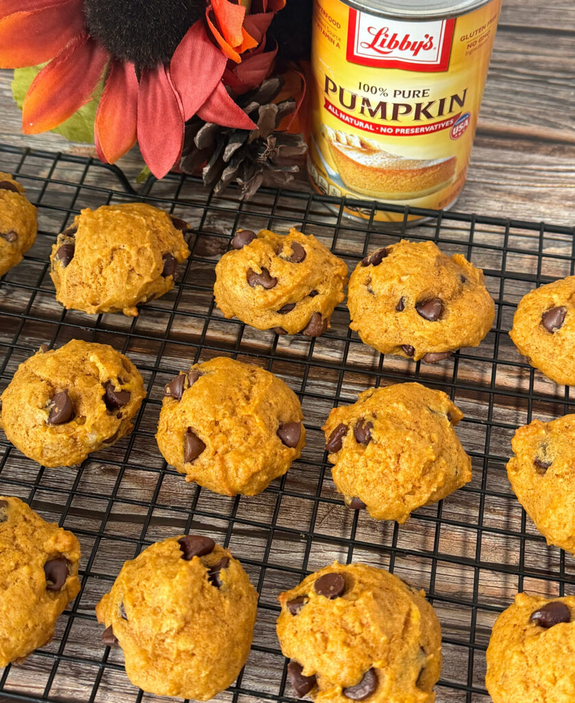 soft pumpkin chocolate chip cookies lined on a cooling rack.