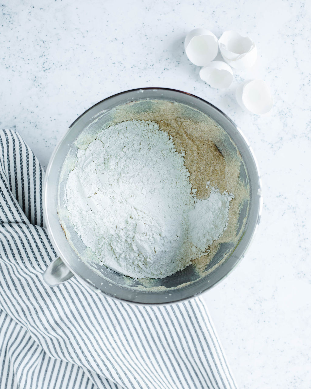 dry ingredients added to a mixing bowl.